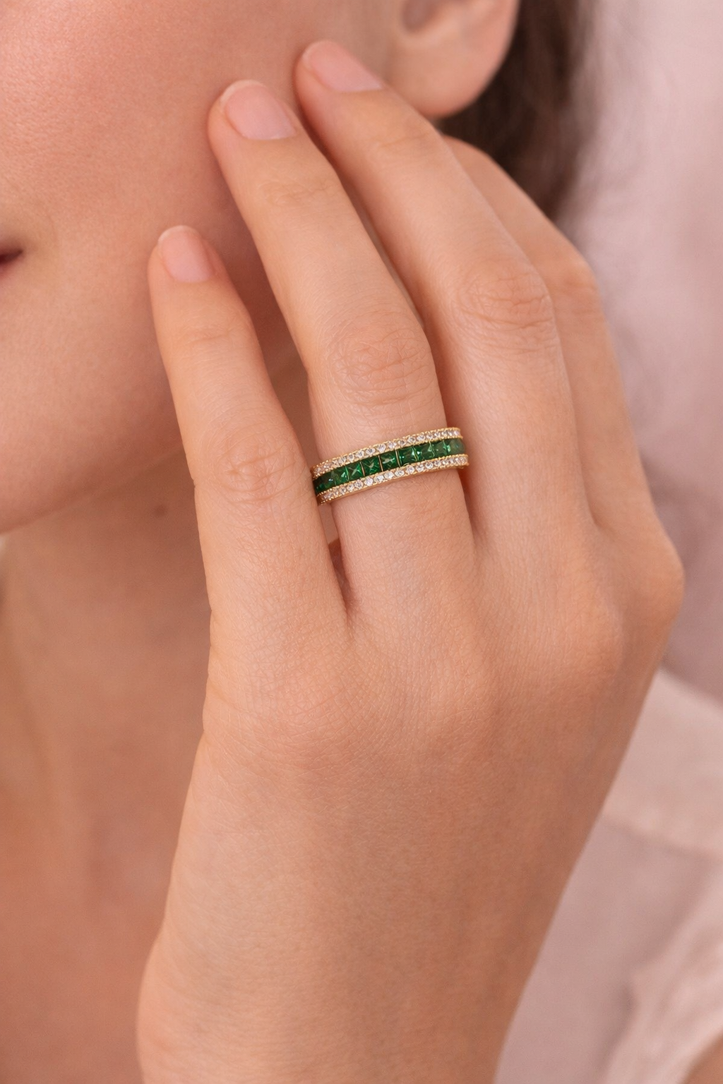 18K gold plated ring with green zirconia worn on hand