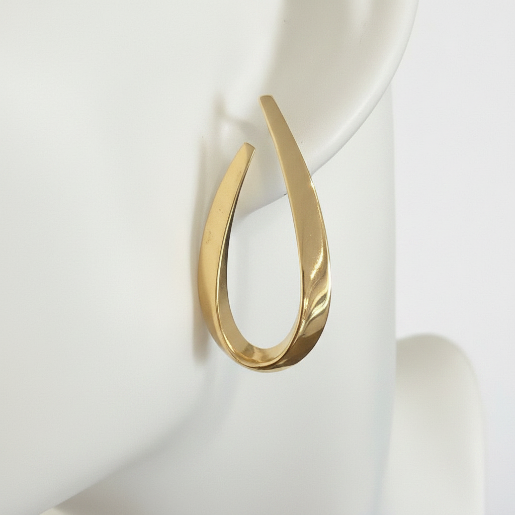 Close-up Polished Gold Teardrop Hoop Earring on mannequin