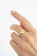 18K gold plated four-leaf clover ring with zirconia on elegant model's hand