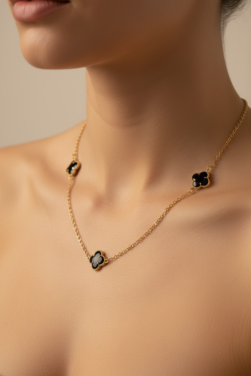 18K gold plated necklace with black clover pendants on female model
